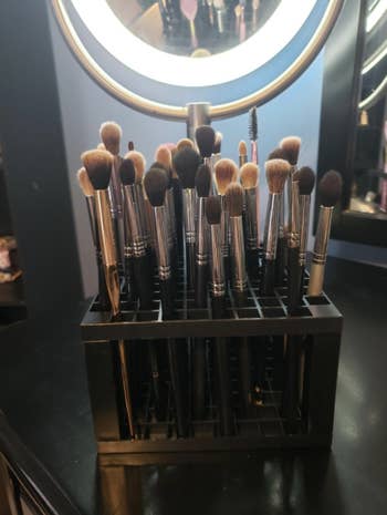 several makeup brushes in the container