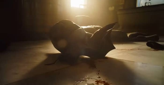 Batman's cowl lying on the floor with blood next to it in