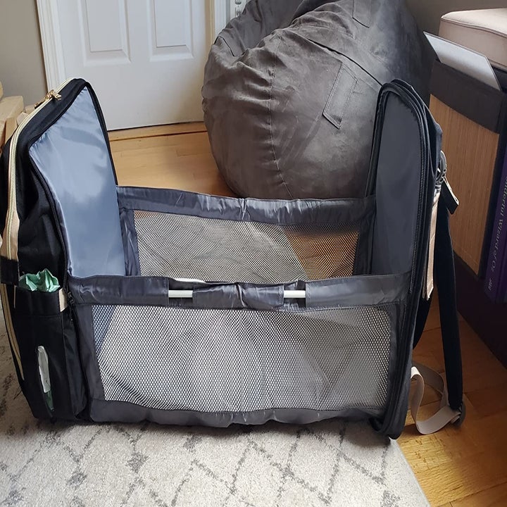 reviewer image of the same bag open to show its changing station feature