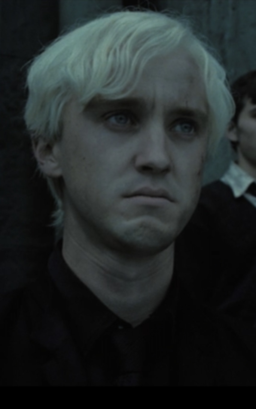 Malfoy pouting, looking scared