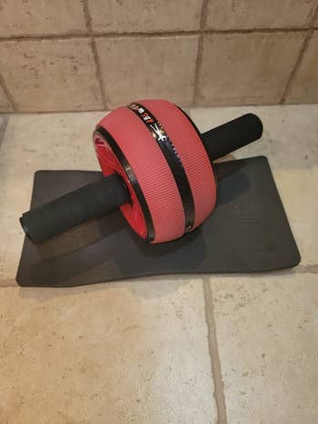Reviewer pic of the ab roller on the floor