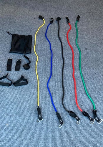 reviewer pic  of the five resistance bands and accessories