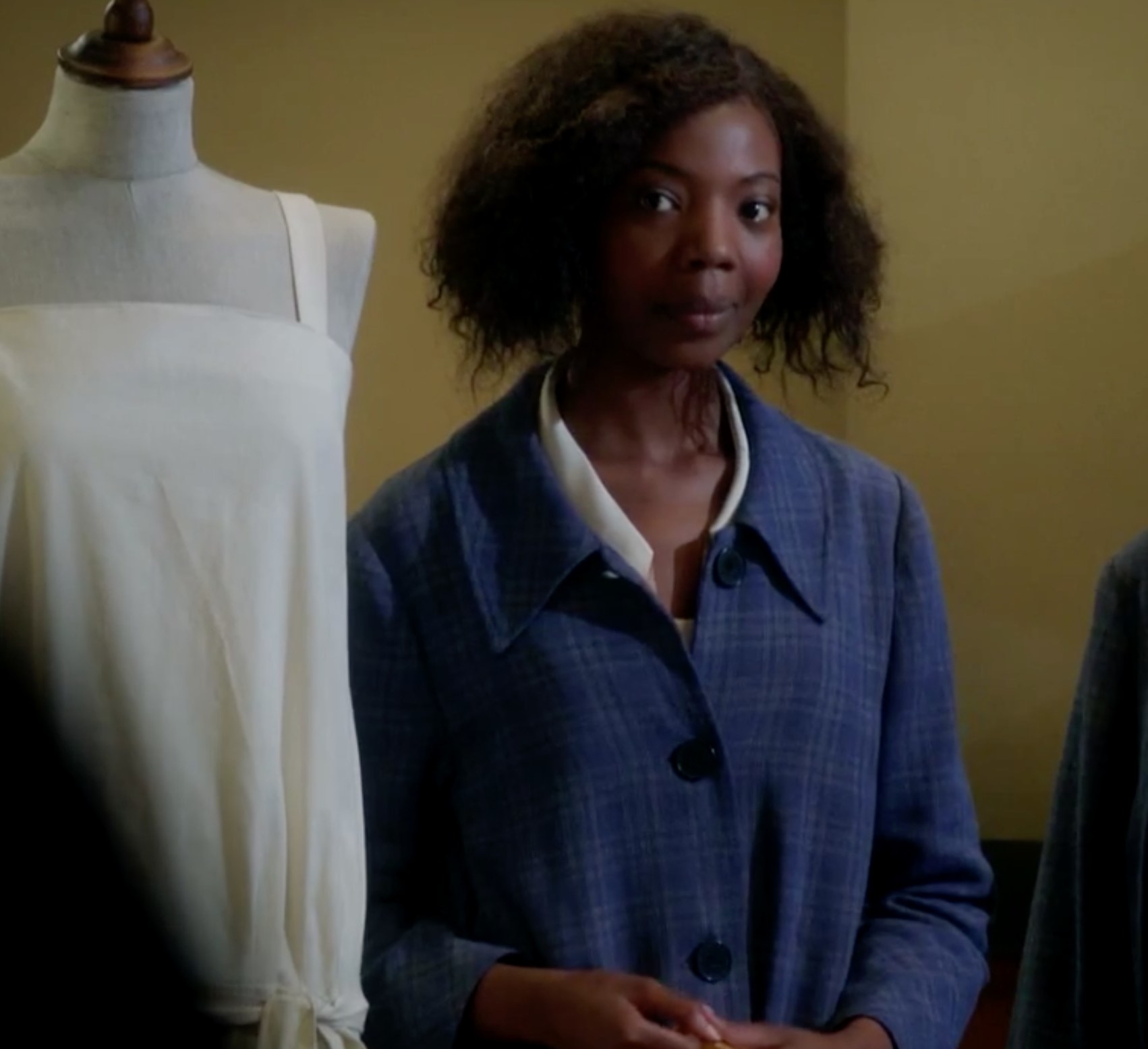 Mimi Ndiweni as Tilly, a seamstress, answers a question proposed by Lady Mae in &quot;Mr Selfridge&quot;