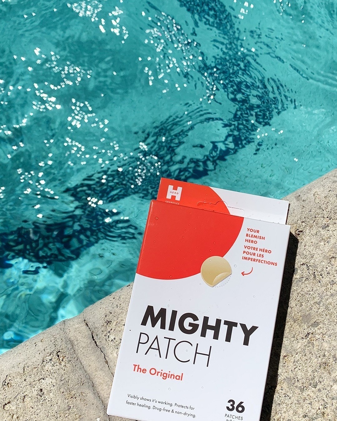 the mighty patch packaging beside a pool