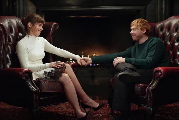 Emma Watson and Rupert Grint holding hands