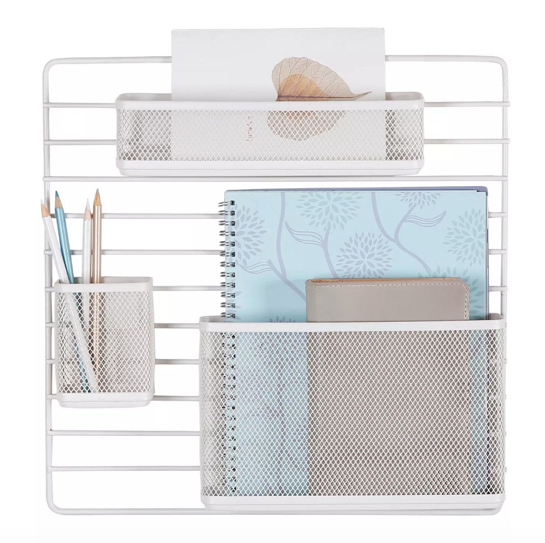 White mesh wall organizer with pencil cup, notebook holder, and card holder