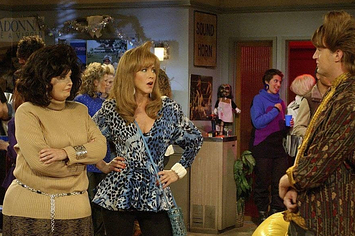 high res image from a scene during the show friends where chandler, monica and rachel are at a party