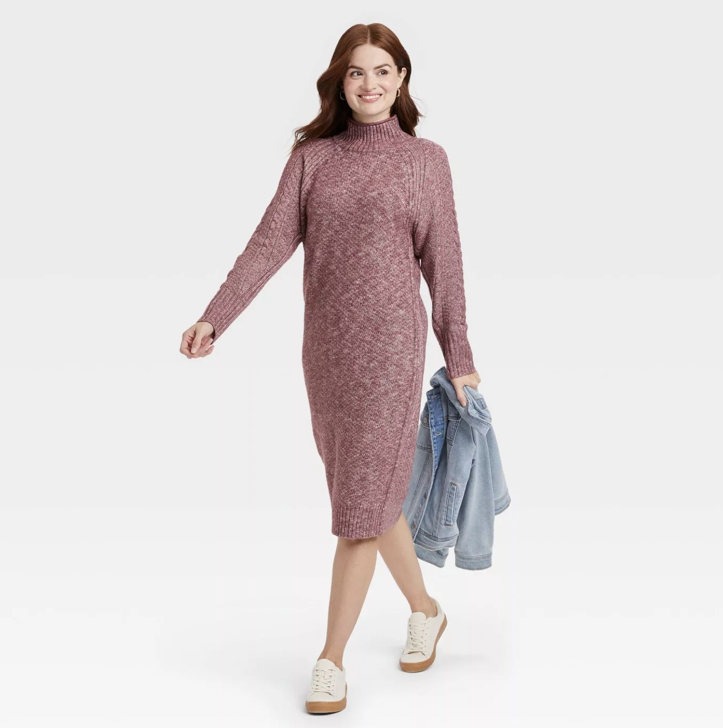 Model wearing the pink knee-length sweater dress