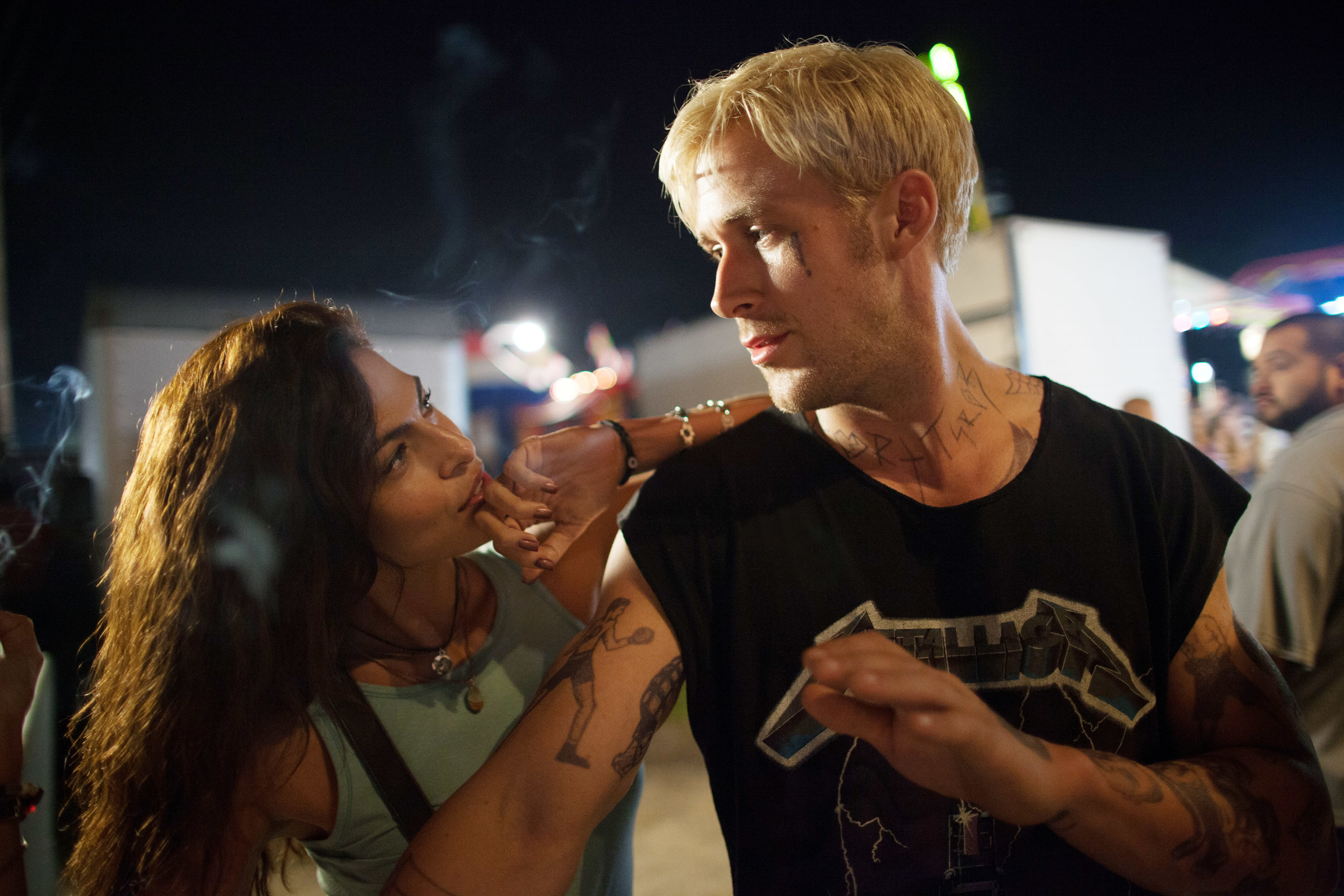 Eva and Ryan look at each other in a moment from their film The Place Beyond the Pines