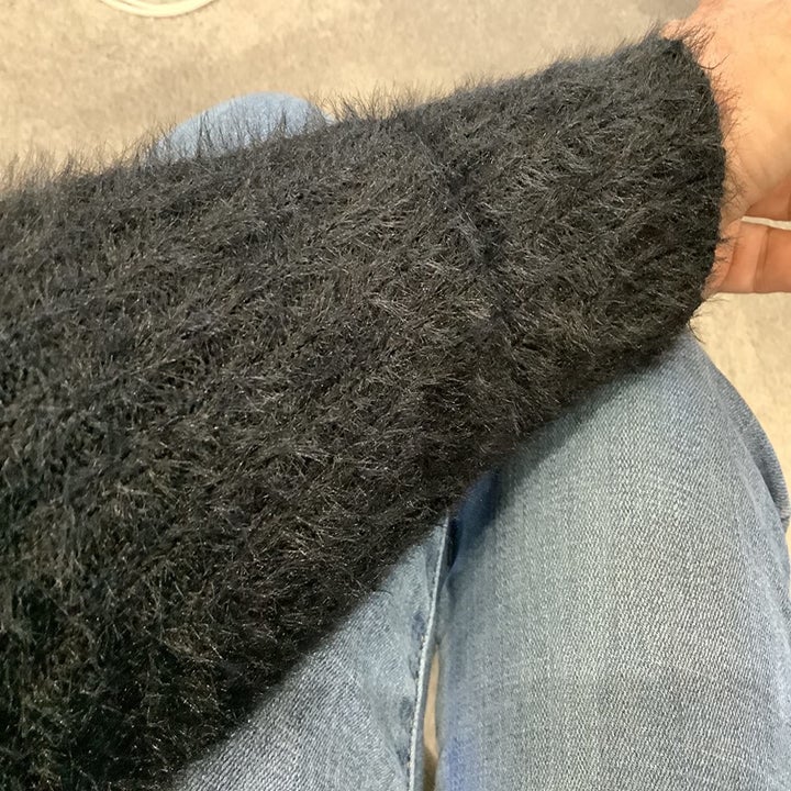 reviewer showing a close up of the fuzzy fabric