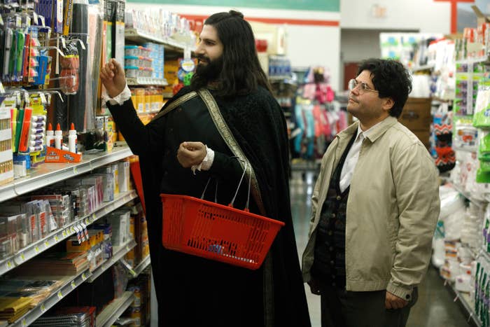 Nandor peruses a craft aisle at a market with Guillermo
