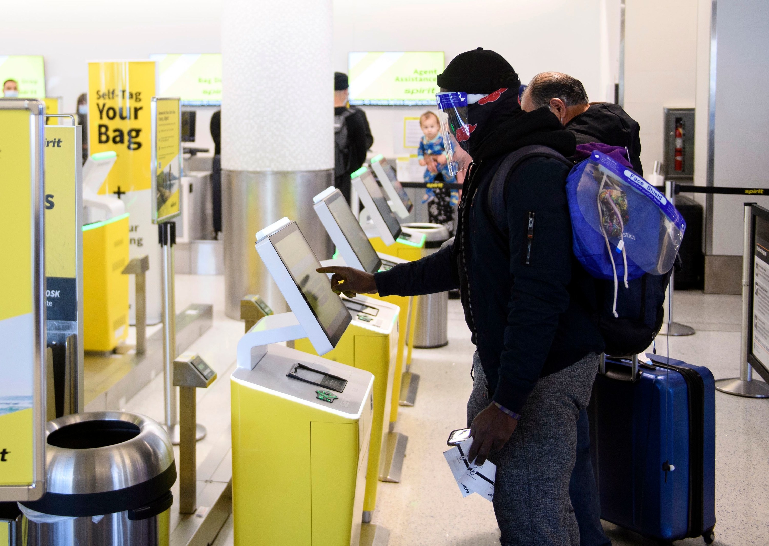 Passengers using Spirit self-bag check