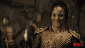 gif of a woman after battle laughing