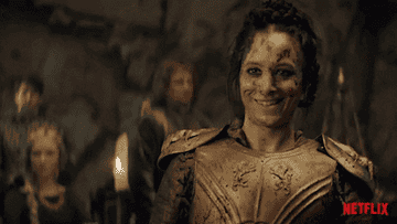 gif of a woman after battle laughing