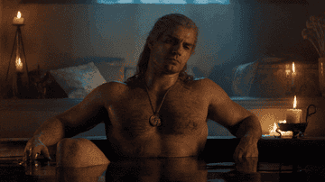 gif of Henry Cavill thinking while taking a bath