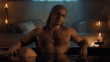 gif of Henry Cavill thinking while taking a bath