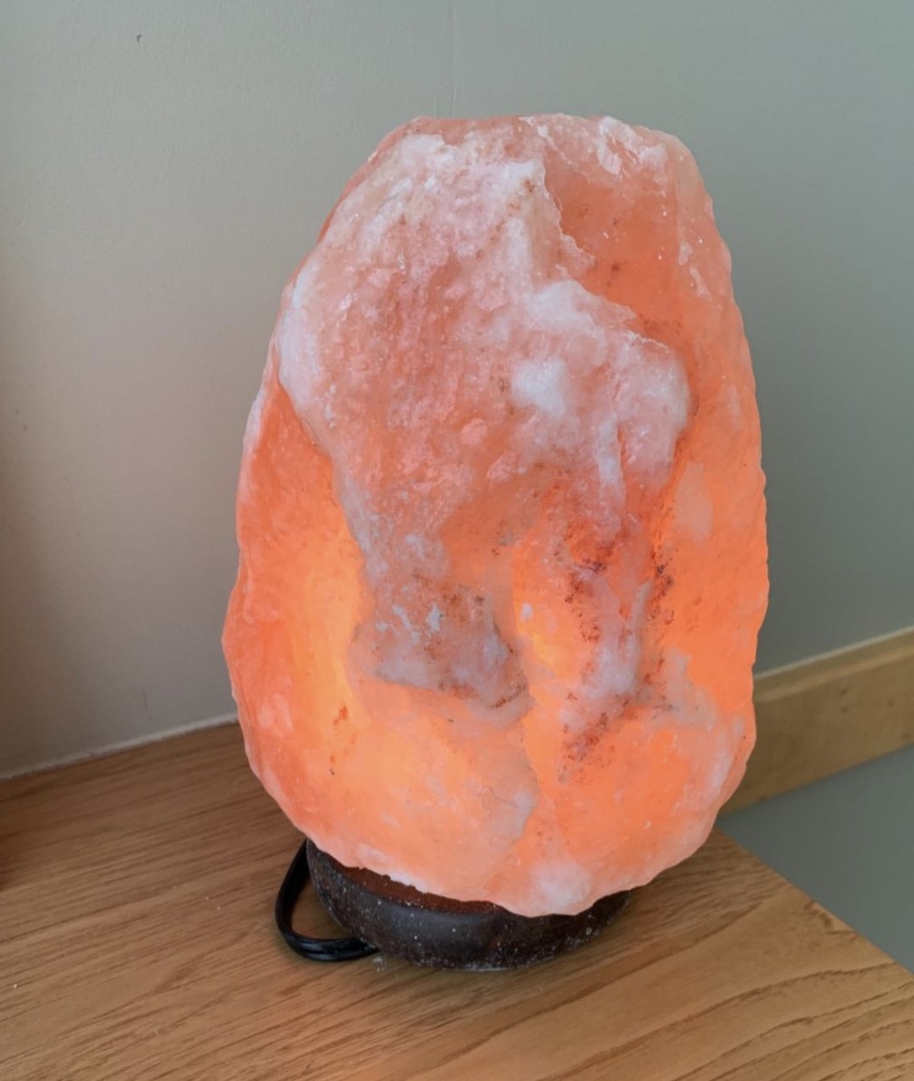 a reviewer&#x27;s salt lamp on a desk
