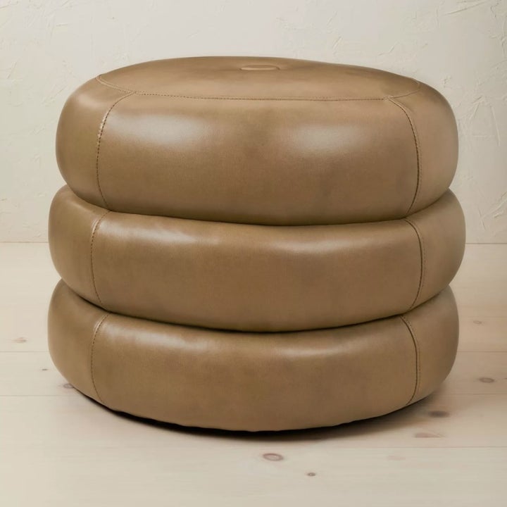 the circular pouf in light brown