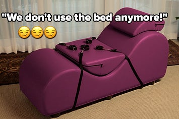 Purple chaise lounge with black restraints and the text "we don't use the bed anymore"