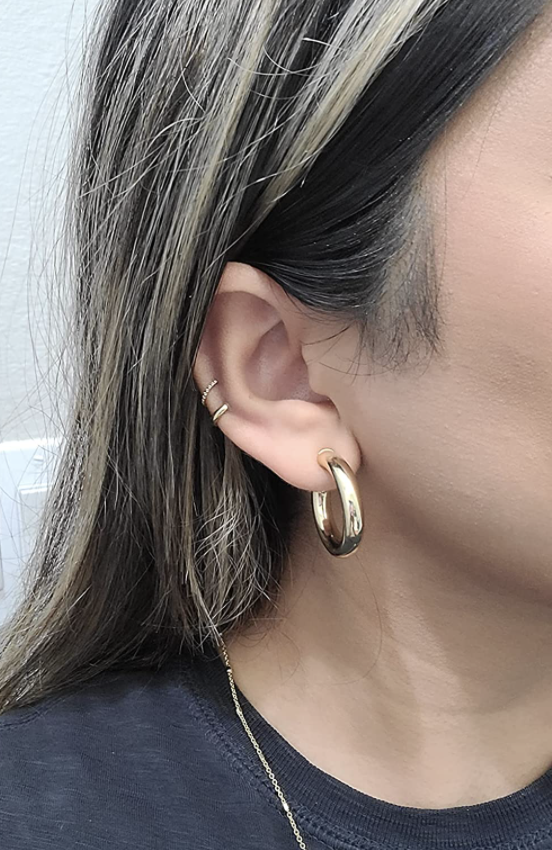 reviewer wearing gold hoops