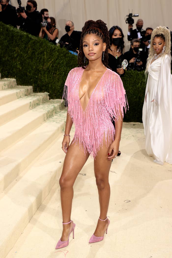 Halle posing in a short fringed dress at the the 2020 Met Gala