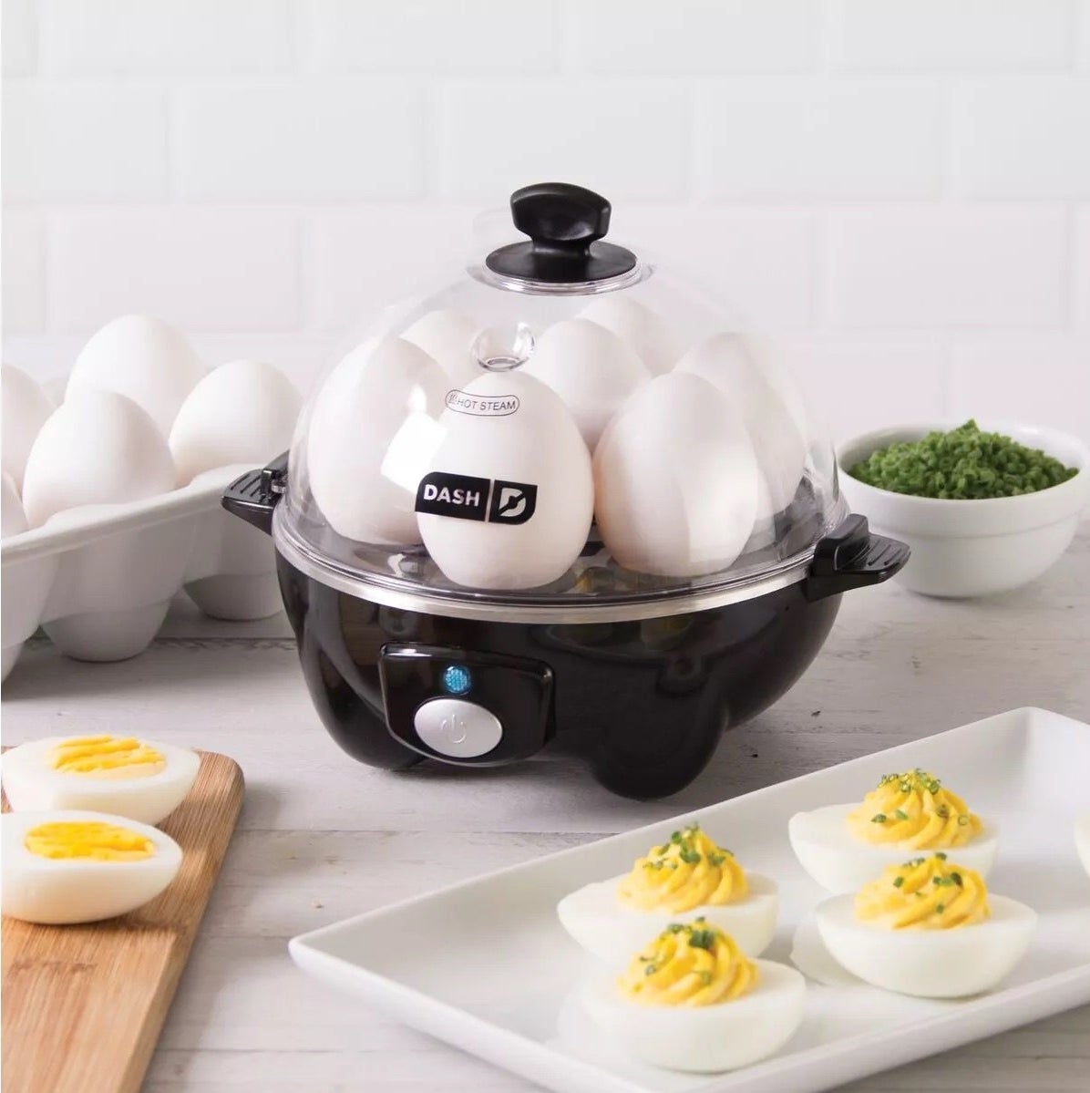 A black egg cooker with deviled eggs