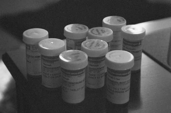 A black and white image of all the prescription bottles Hannah was taking