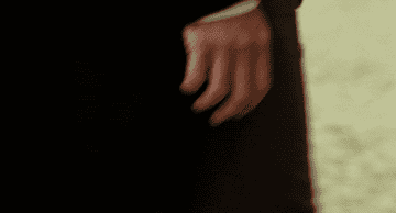 a close up of Mr. Darcy's hand flexing as he's walking away