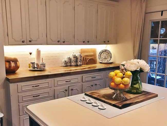 reviewer image of kitchen cabinets with lighting installed underneath