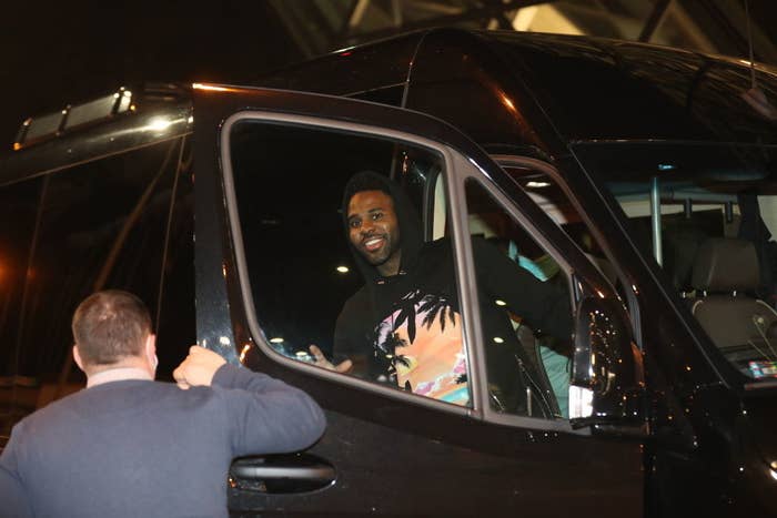 Jason smiling as he sits in a car