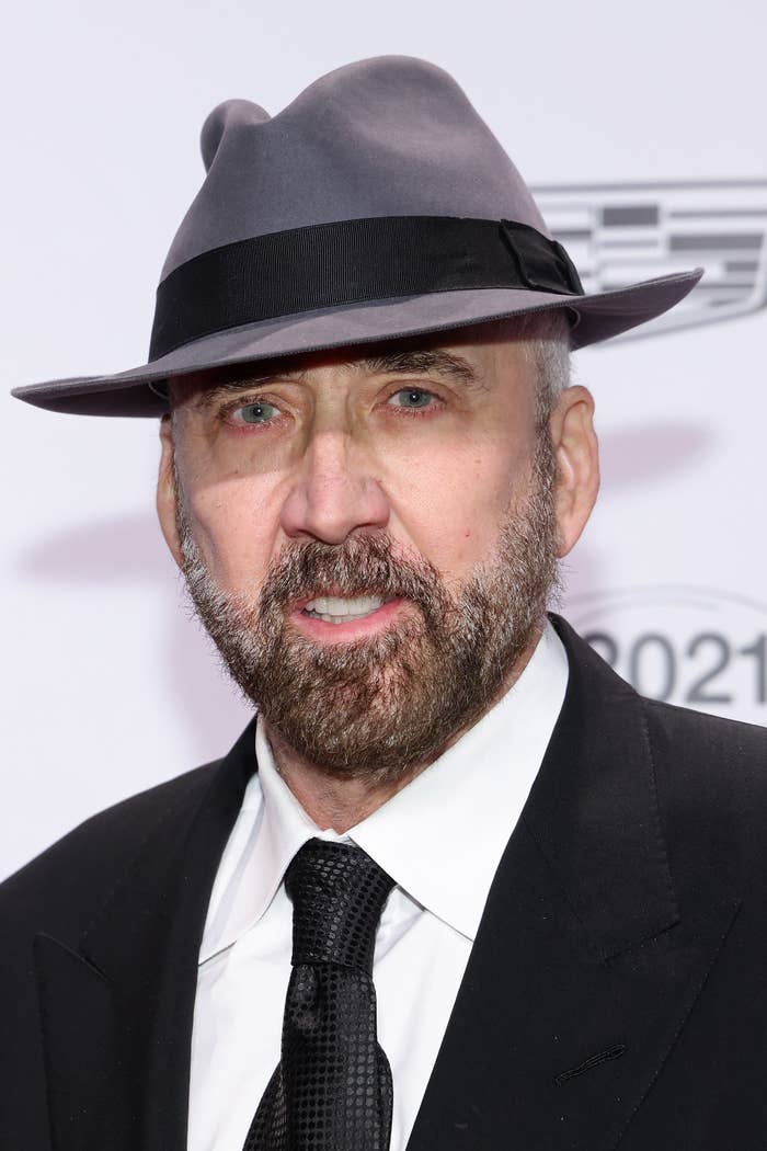 Nicolas Cage wears a hat on the red carpet