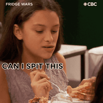 Woman eating food saying