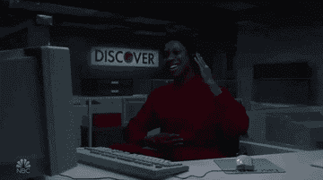 Ego Nwodim smiles at a desk before frowning and saying