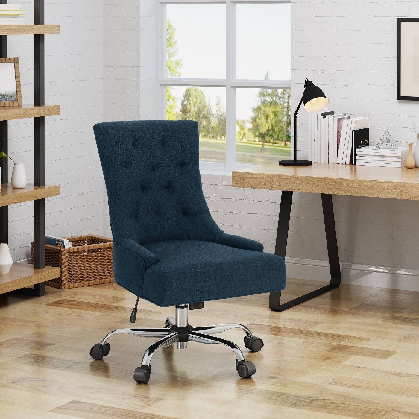 bluetufted wheeled desk chair in home office
