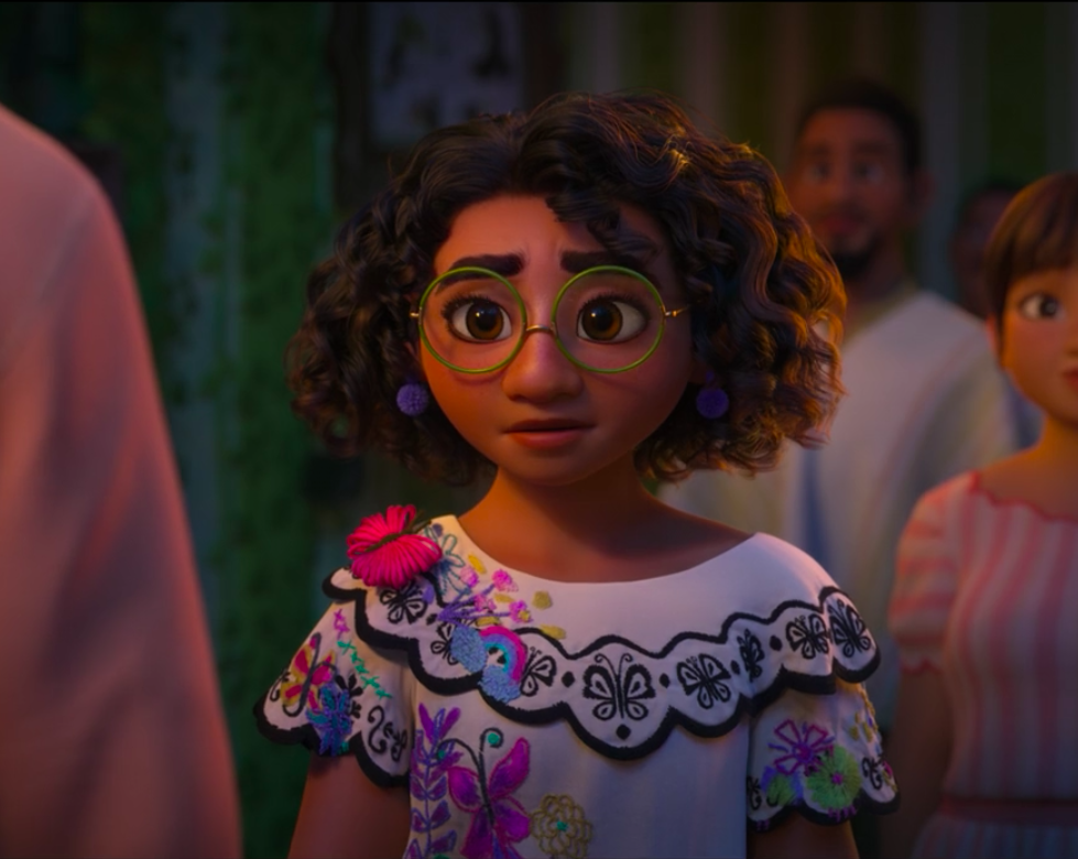 Maribel wearing a beautiful embroidered dress and wearing large eyeglasses