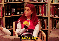 Ariana Grande eating a taco sadly while saying &quot;Tacos. Yay.&quot;