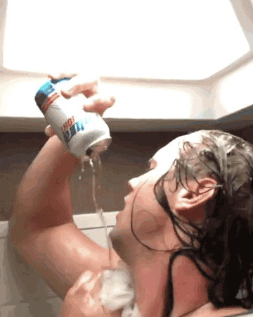 Man showering while chugging a Natural Light beer