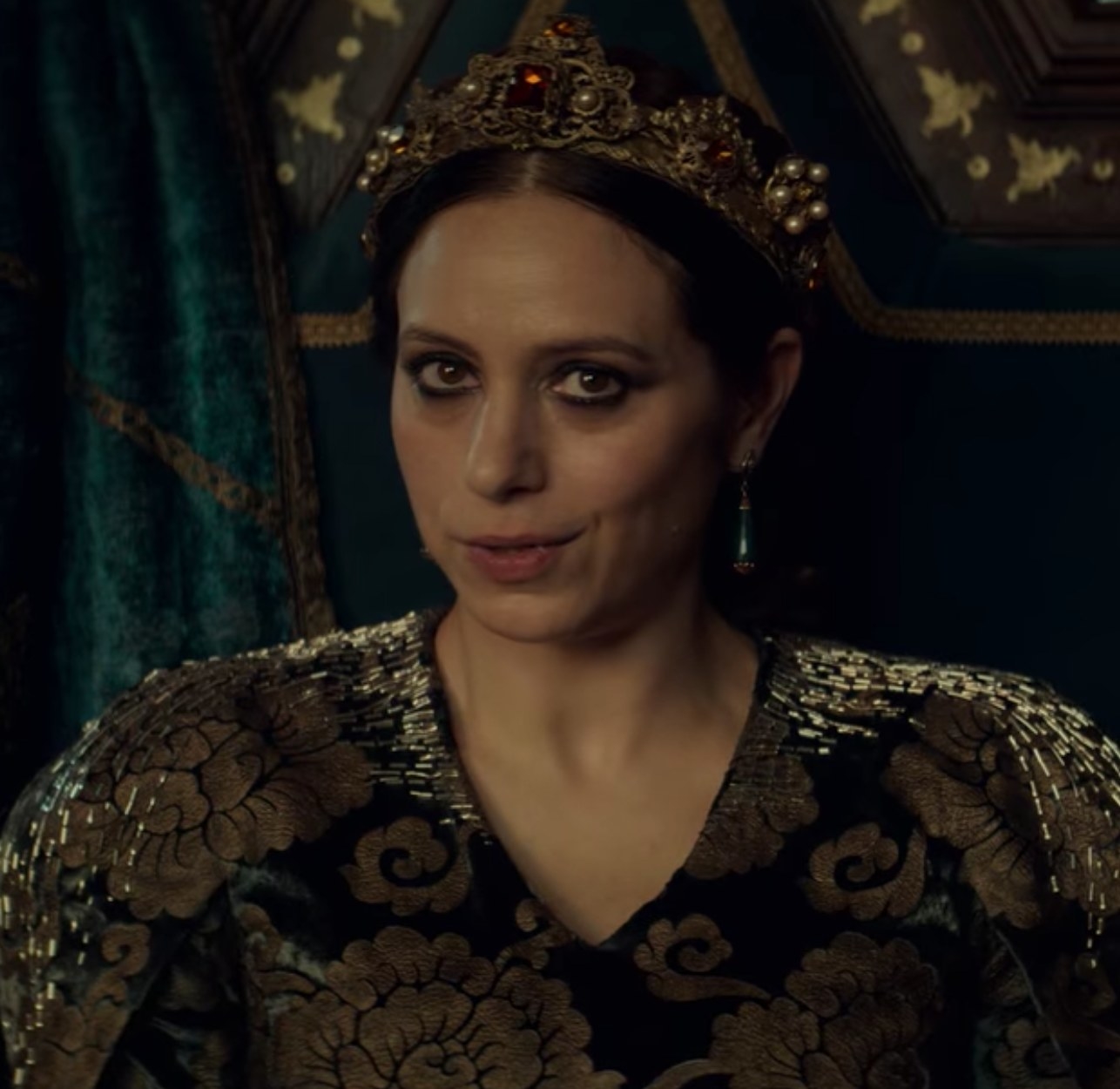 Jodhi May as Queen Calanthe speaks to Geralt while seated at a banquet feast in &quot;The Witcher&quot;