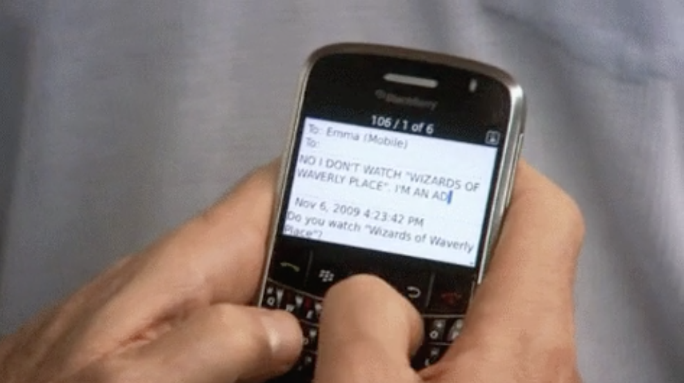 close up of a person using a Blackberry phone
