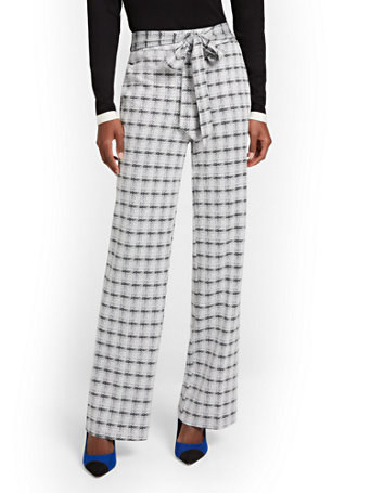 model in plaid pants with tie belt