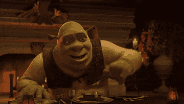 Shrek pretending to enjoy his hand washing bowl that he thought was soup