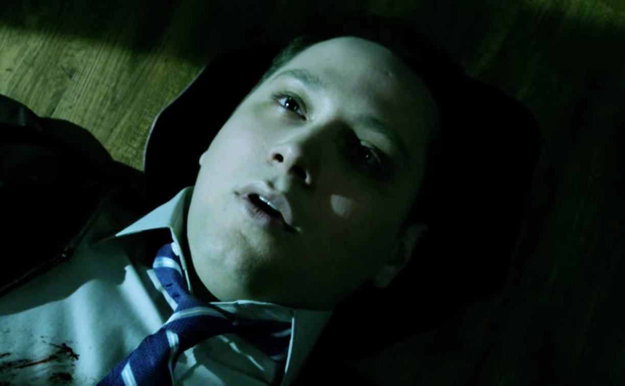 Matt McGorry As Asher Millstone in an episode of how to get away with murder on the floor with blood behind his head