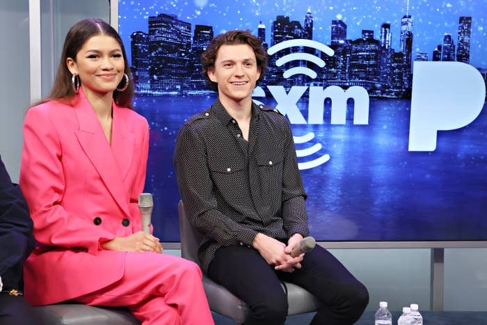 Zendaya and Tom Holland sitting next to each other at the SiriusXM studio