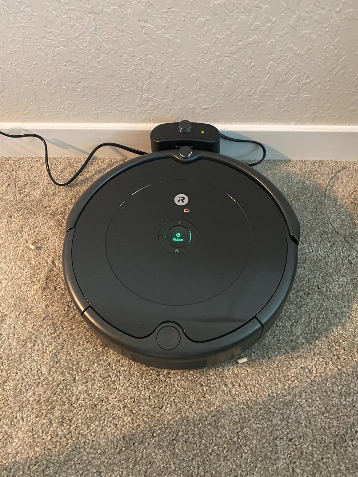 reviewer pic or the roomba vacuum in its dock