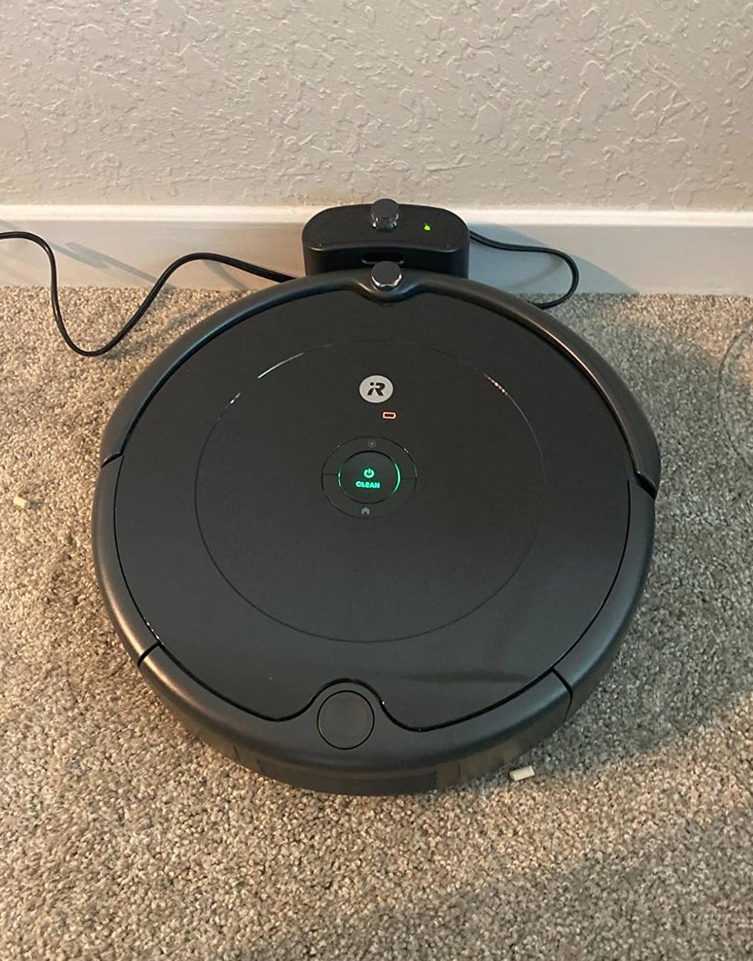 reviewer pic or the roomba vacuum in its dock