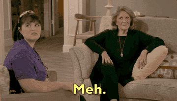 Gif of two people saying &quot;meh&quot;