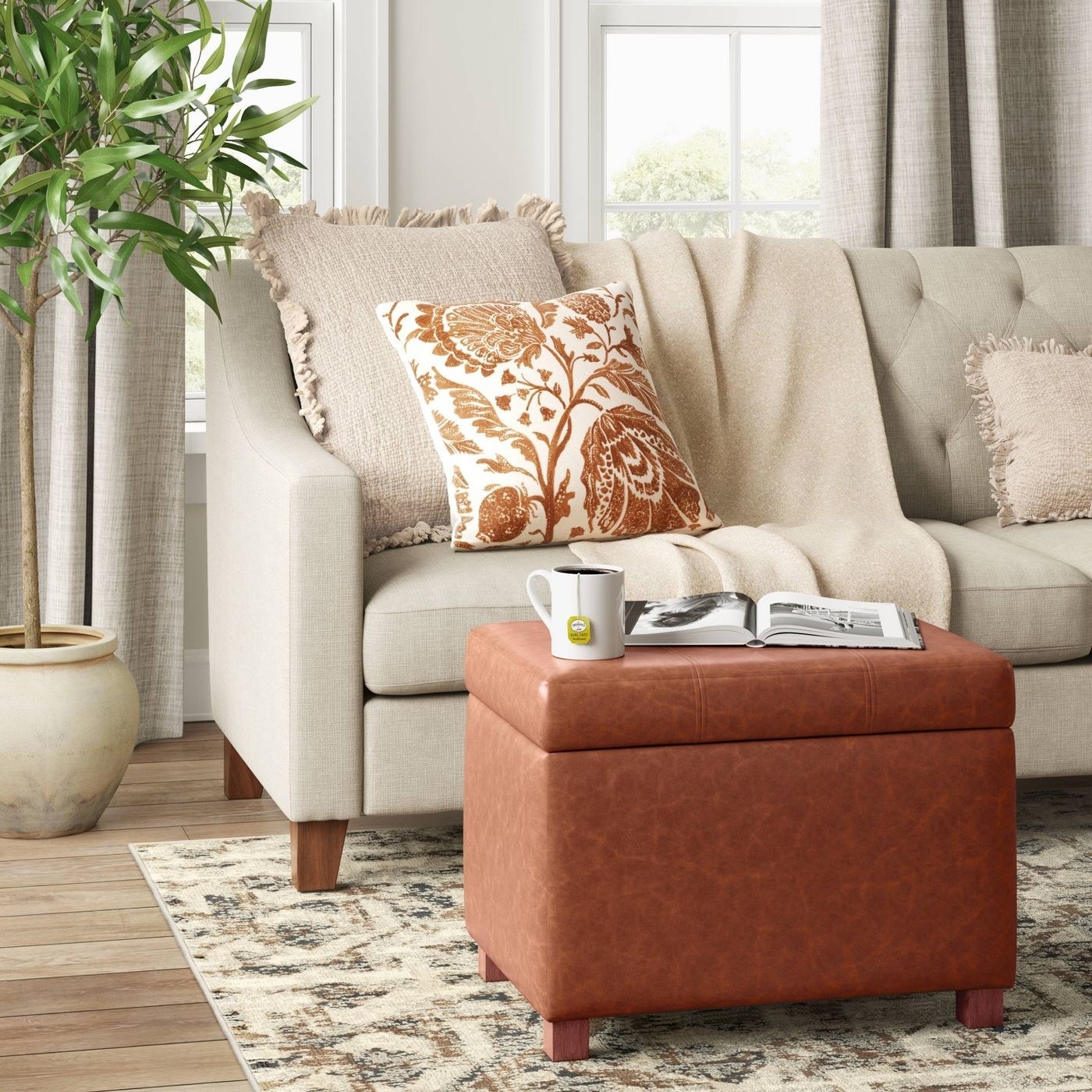 the brown leather ottoman in a living room