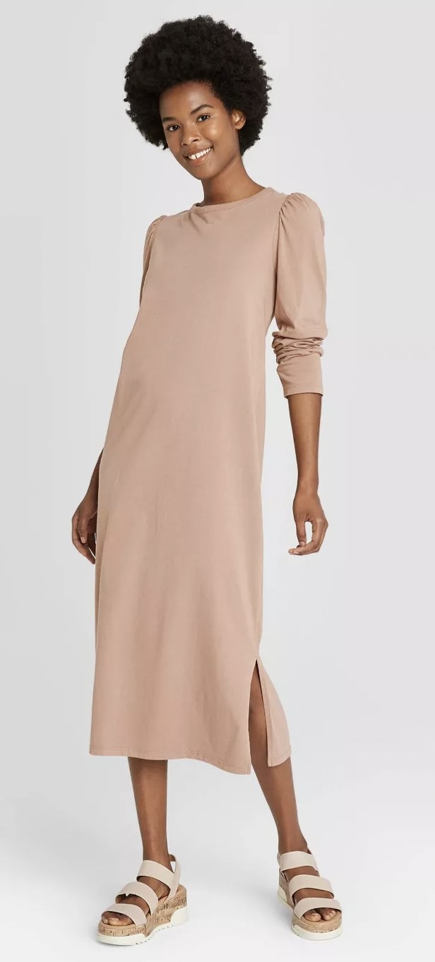 model wearing the dress in a beige color