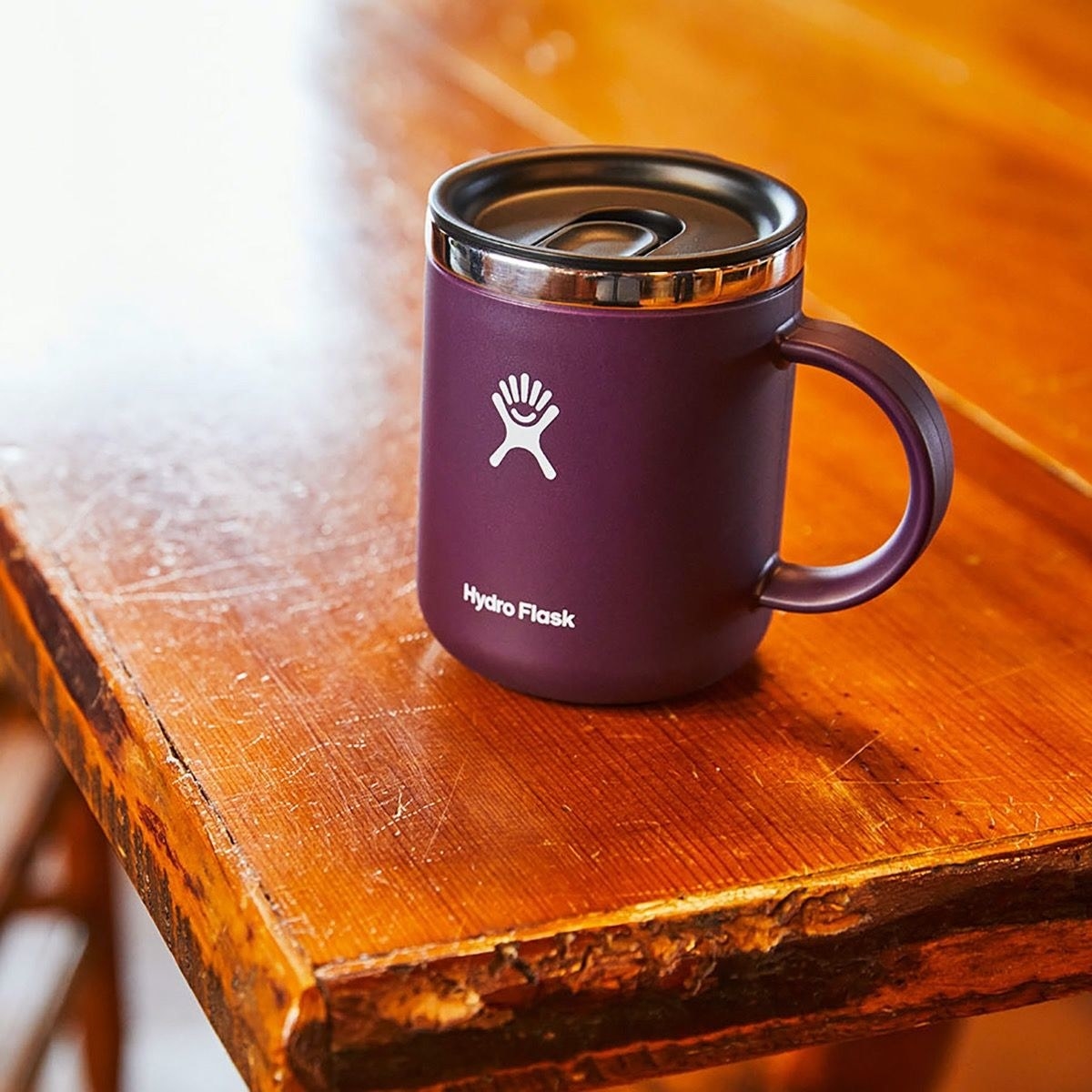 a purple hydro flask coffee mug