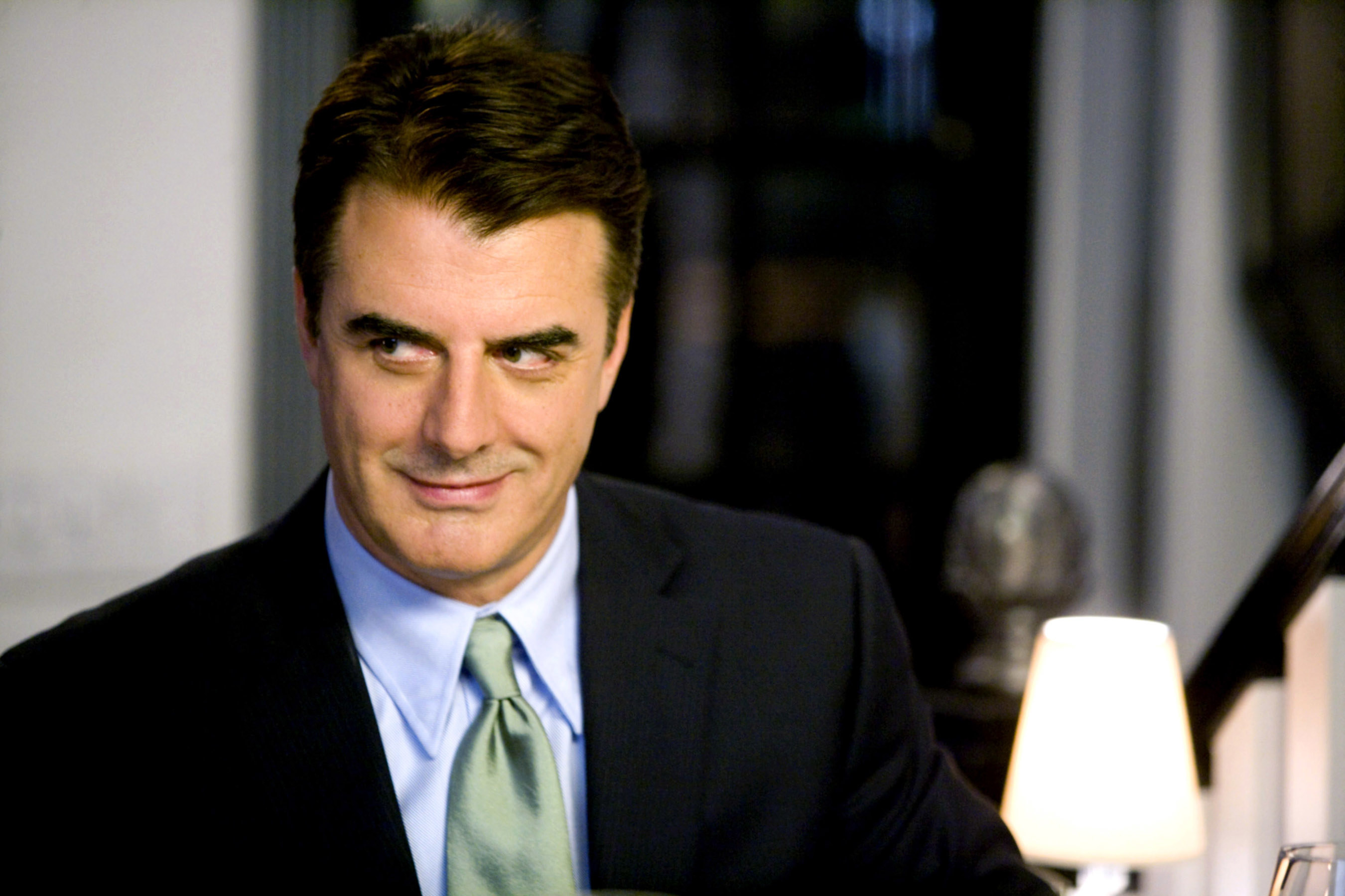 Chris Noth looks to the side
